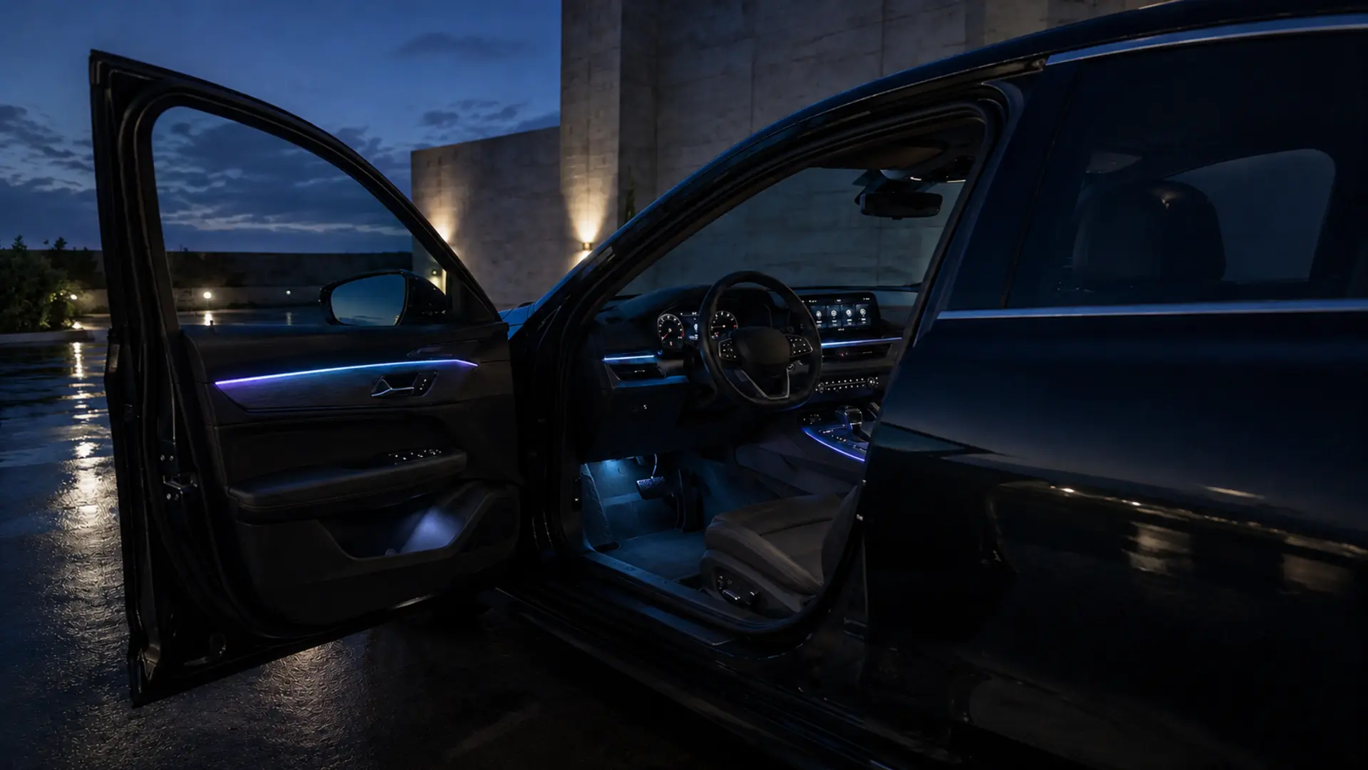 Open vehicle door revealing a restrained premium night cabin